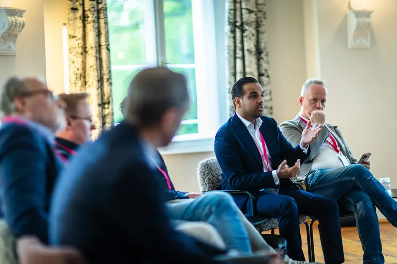 Kamran Roske and Marc Hildebrandt listening attentively to the panel