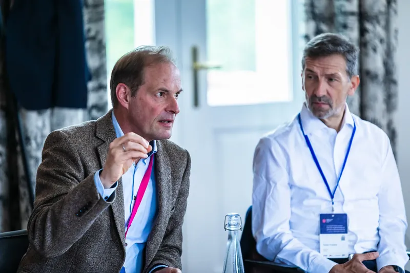 Dr. J&uuml;rgen Sturm and Dr. Stefan Poledna in dialogue during the panel session