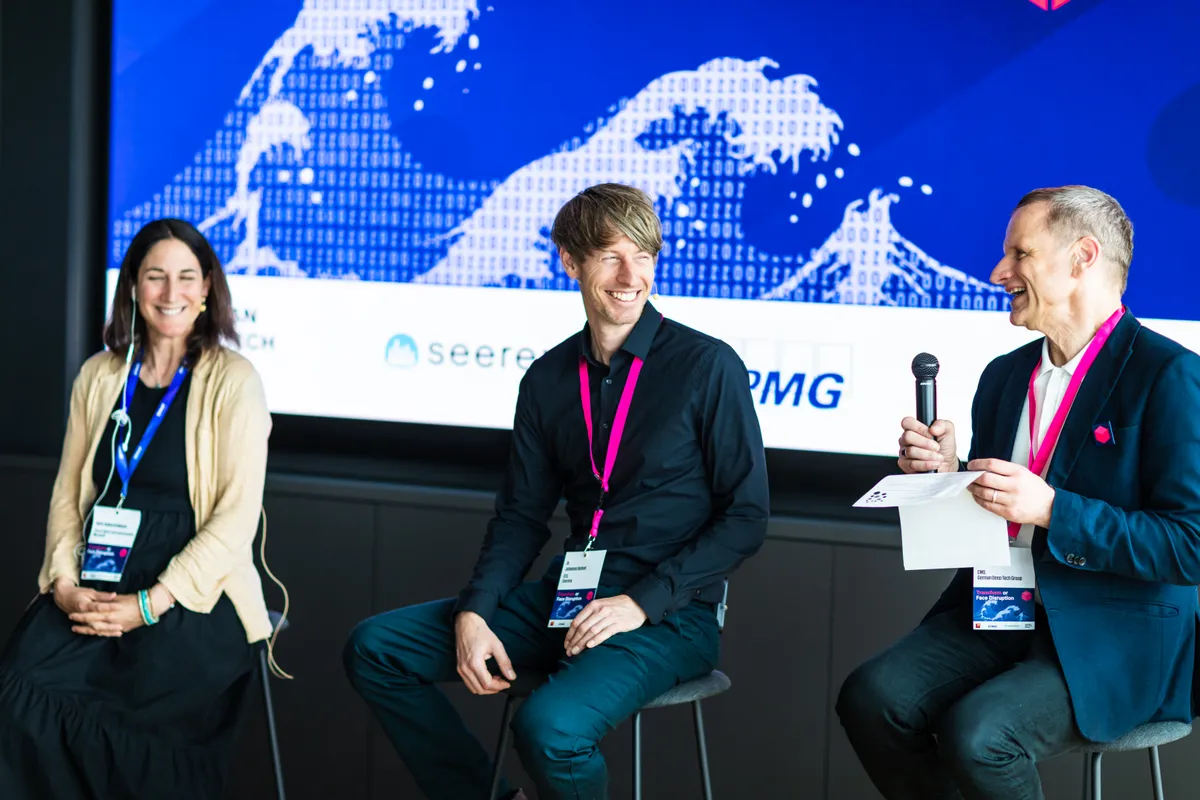 Panel experts sharing a laugh